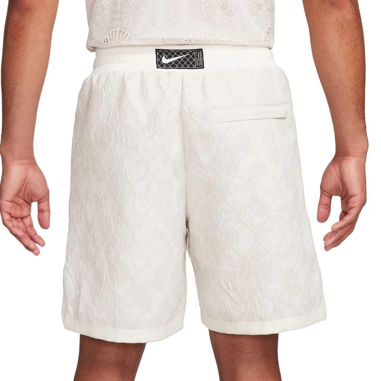 pantalon-corto-nike-dna-woven-8-new-age-of-sport-pale-ivory-sail-1